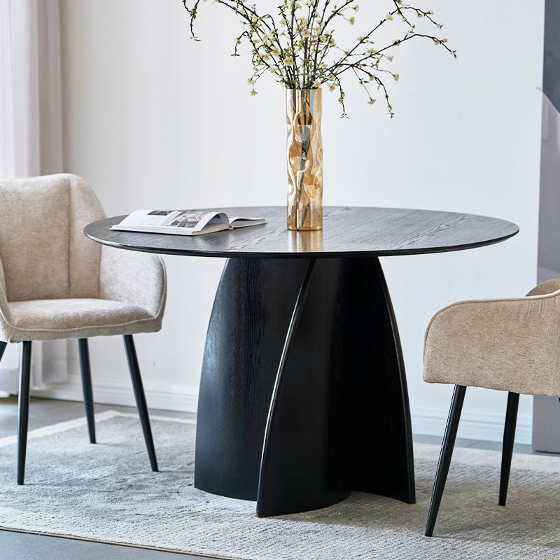 Modernisez votre salle à manger avec la table ronde noire Gemma 120 cm d’OFCASA : plateau en MDF audacieux et base en placage bois pour un style contemporain